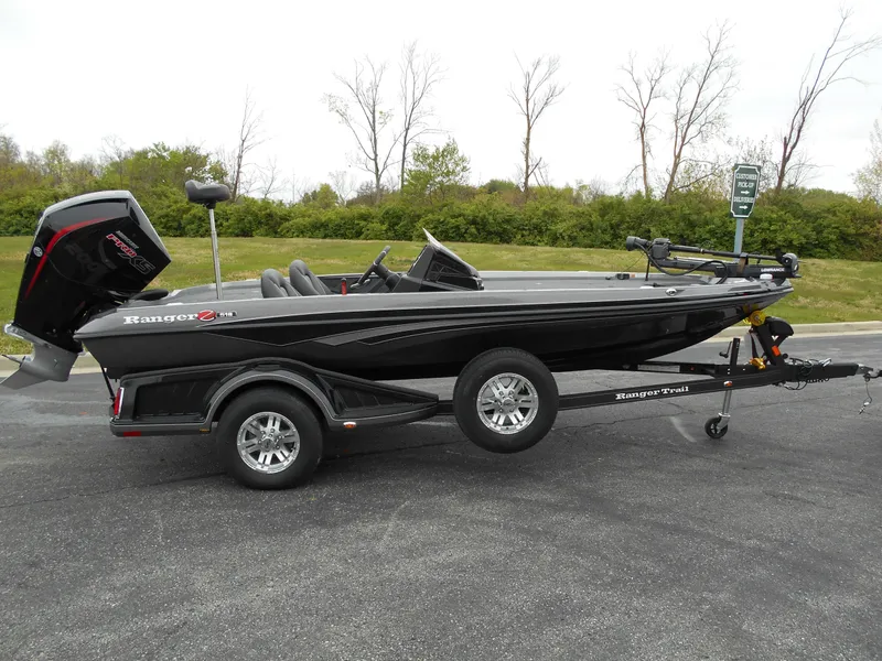 Slide: The Image of 2024 Ranger Z518 Ranger Cup Equipped boat on trailer, black exterior, side view. - 0