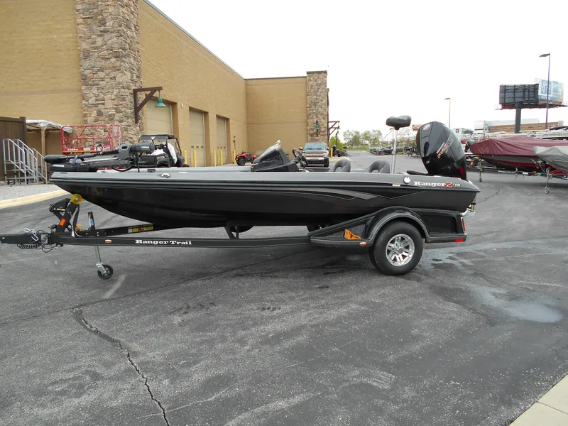 Slide: The Image of 2024 Ranger Z518 Ranger Cup Equipped boat on trailer in parking lot. - 2