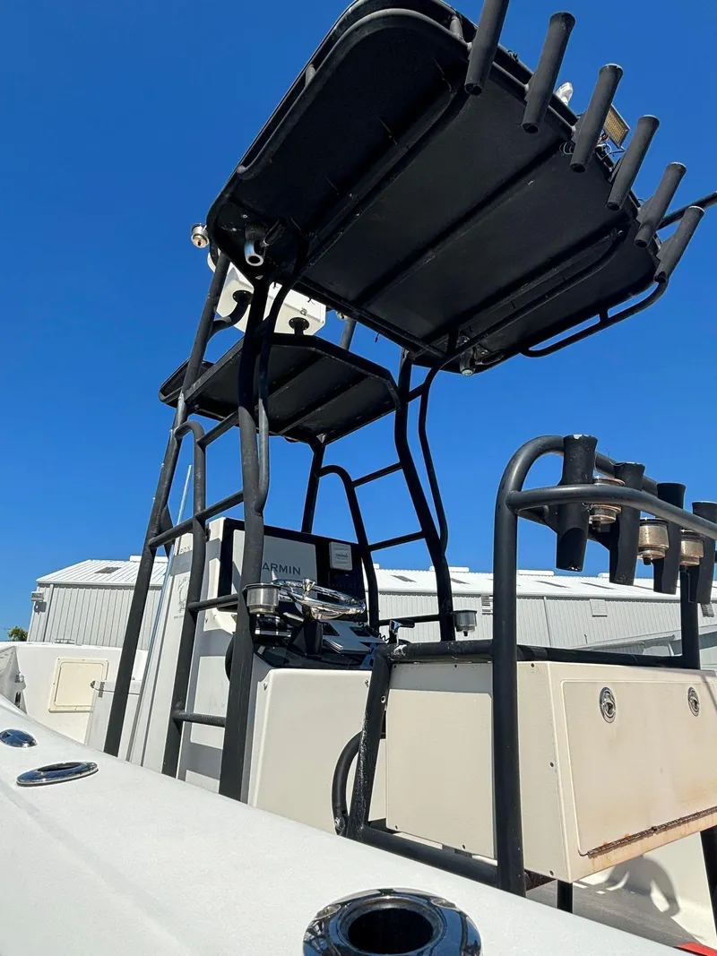 Slide: The Image of 2014 Andros Tarpon 26 boat with T-top and rod holders. - 13