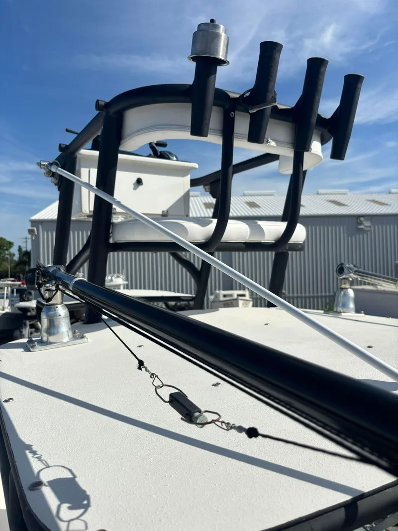 Slide: The Image of 2014 Andros Tarpon 26 boat with rod holders and outriggers. - 14