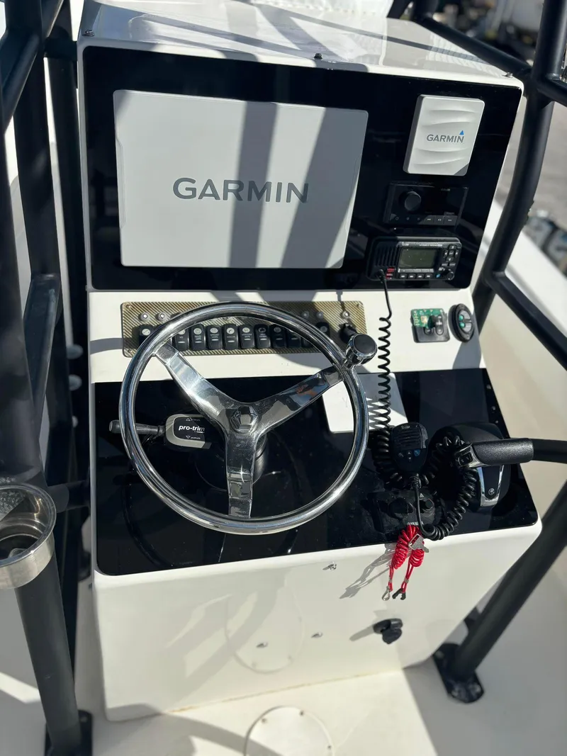 Slide: The Image of 2014 Andros Tarpon 26 boat console with Garmin navigation system. - 15