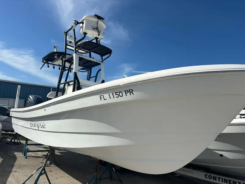 Slide: The Image of 2014 Andros Tarpon 26 boat on stands, side view. - 3