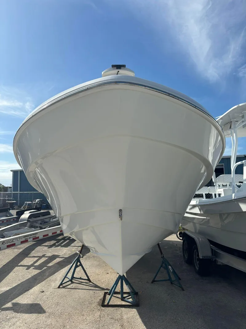 Slide: The Image of 2014 Andros Tarpon 26 boat on stands, front view. - 4