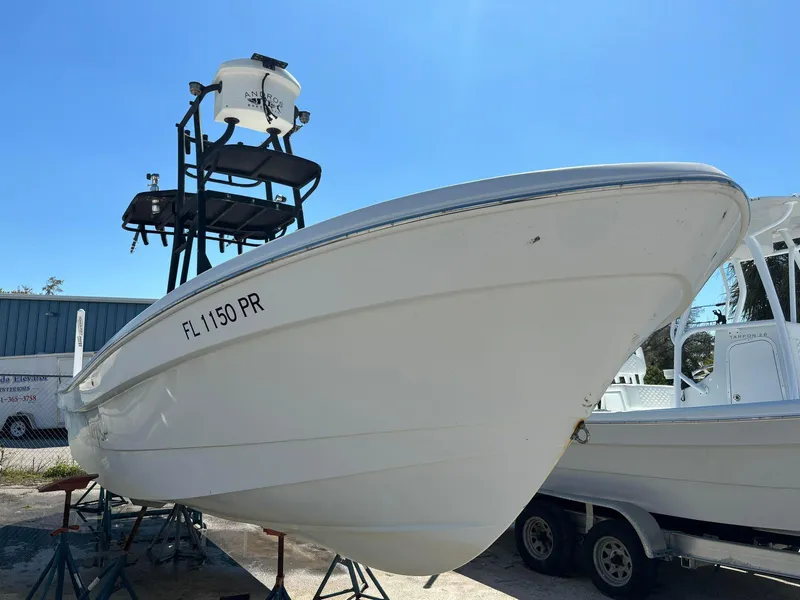 Slide: The Image of 2014 Andros Tarpon 26 boat on stands, side view, with radar tower. - 6