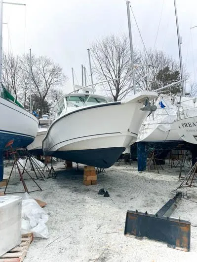 Slide: The Image of 2008 Boston Whaler 345 Conquest boat on dry dock for maintenance. - 11