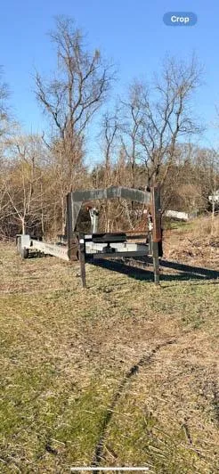 Slide: The Image of 2008 Boston Whaler 345 Conquest boat trailer in a grassy field - 13