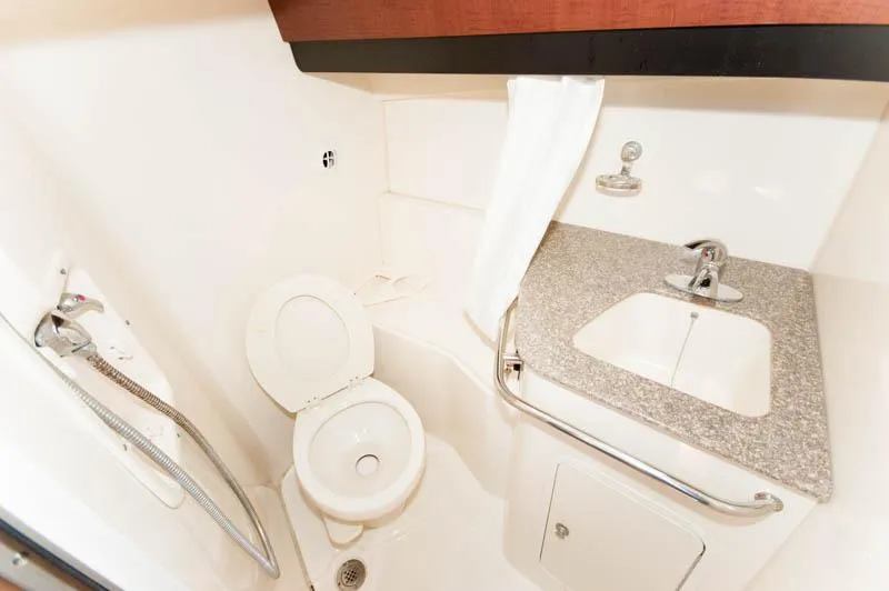 Slide: The Image of 2008 Boston Whaler 345 Conquest bathroom with toilet, sink, and shower. - 20