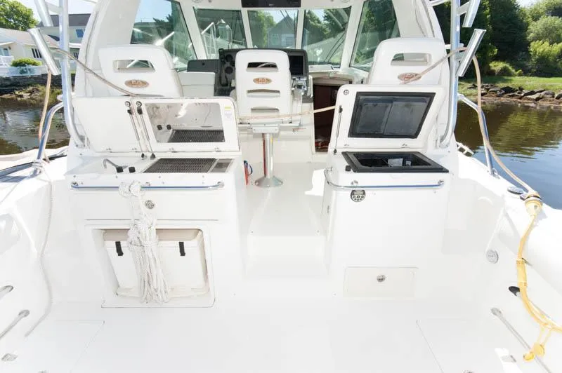 Slide: The Image of 2008 Boston Whaler 345 Conquest boat interior with seating and control panel. - 3
