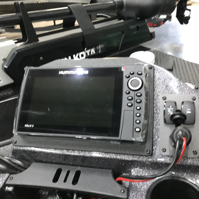 Slide: The Image of 2024 Ranger RT198P boat dashboard with Humminbird Helix 9 fishfinder and Minn Kota trolling motor. - 12