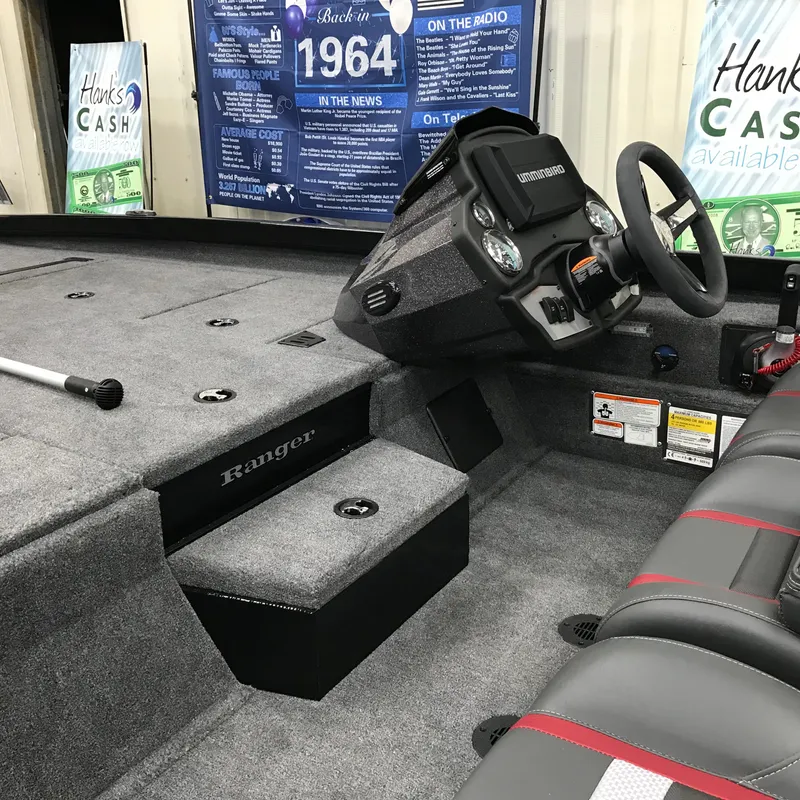 Slide: The Image of 2024 Ranger RT198P boat interior with steering console and seating. - 7