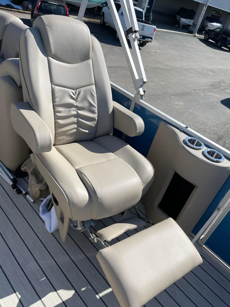 Slide: The Image of 2024 SunCatcher 322rc boat seat with footrest on deck. - 17