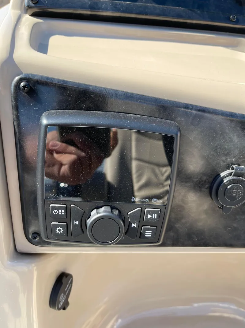 Slide: The Image of 2024 SunCatcher 322rc control panel with display and buttons. - 22