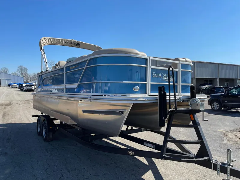 Slide: The Image of 2024 SunCatcher 322rc pontoon boat on trailer in outdoor lot. - 4