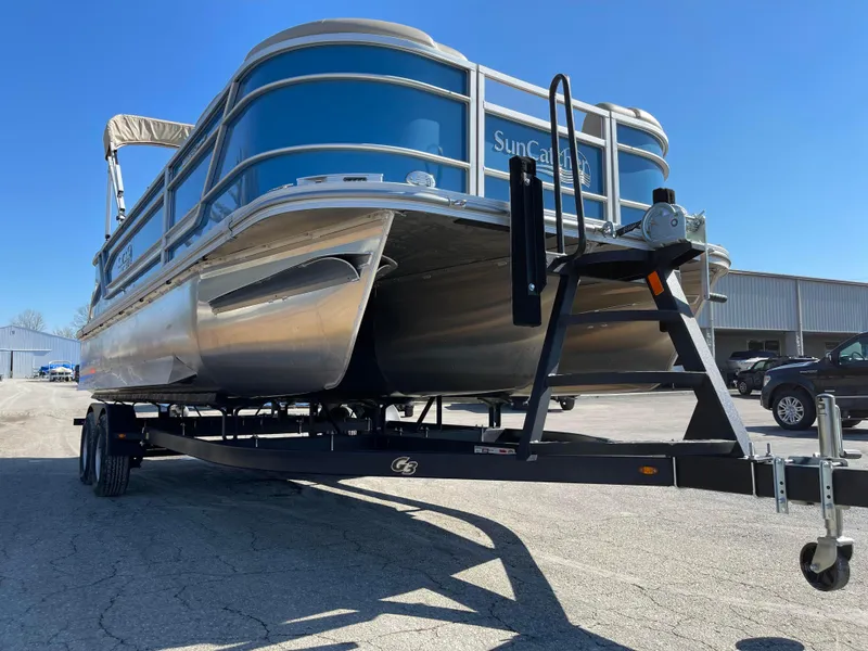 Slide: The Image of 2024 SunCatcher 322rc pontoon boat on trailer in outdoor setting. - 5