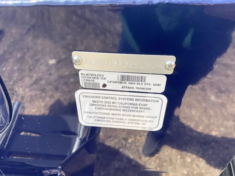 Slide: The Image of 2024 Tracker Targa V-19 Combo emissions control information and serial number plate. - 5