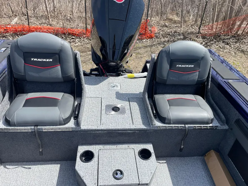Slide: The Image of 2024 Tracker Targa V-19 Combo boat interior with two seats and motor. - 6