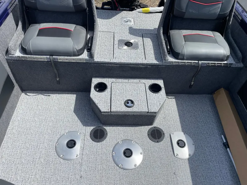 Slide: The Image of 2024 Tracker Targa V-19 Combo boat interior with seating and storage compartments. - 8