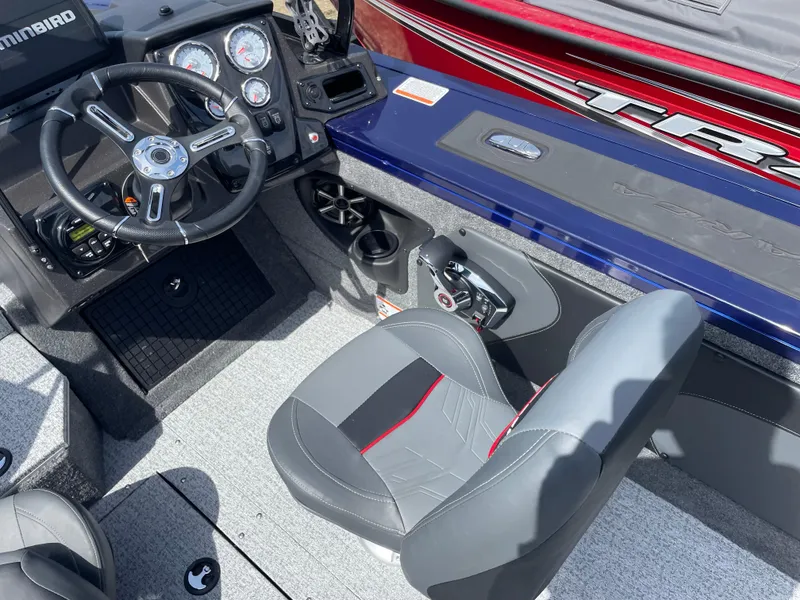 Slide: The Image of 2024 Tracker Targa V-19 Combo boat interior with steering wheel and captain's seat. - 9