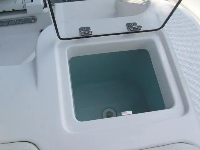 Slide: The Image of 2024 Edgewater 245CX livewell with open lid. - 10