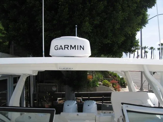 Slide: The Image of 2024 Edgewater 262 CX boat with Garmin radar. - 12