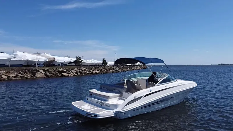Slide: The Image of 2011 Sea Ray 240 Sundeck boat cruising on a sunny day. - 3