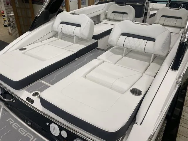 Slide: The Image of 2024 Regal LS6 boat with luxurious white seating and spacious swim platform. - 10