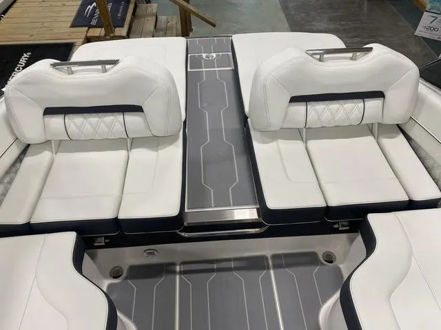 Slide: The Image of 2024 Regal LS6 boat with luxurious white seating and modern design. - 11