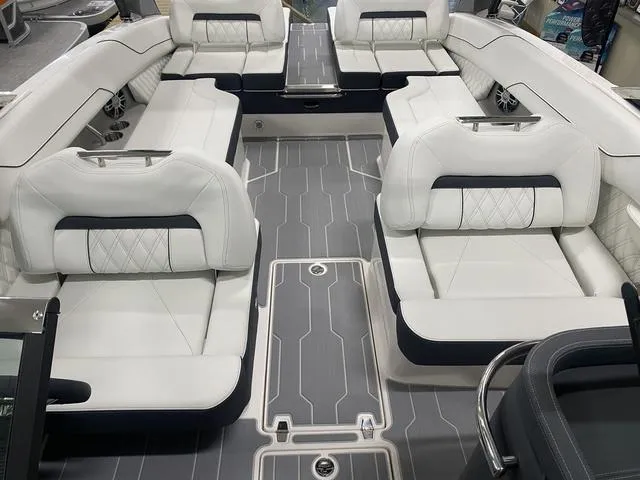 Slide: The Image of 2024 Regal LS6 boat interior with luxurious white seating and modern design. - 16