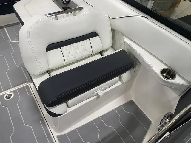 Slide: The Image of 2024 Regal LS6 boat dashboard with modern steering wheel and dual touchscreen displays. - 19