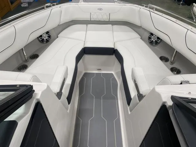 Slide: The Image of 2024 Regal LS6 boat interior with white and black seating. - 23
