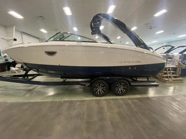 Slide: The Image of 2024 Regal LS6 boat on display in an indoor showroom. - 3