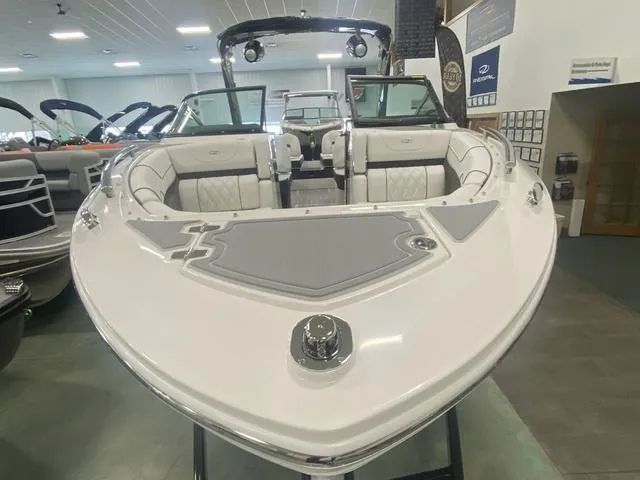 Slide: The Image of 2024 Regal LS6 boat on display in showroom, front view. - 6