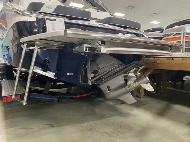 Slide: The Image of 2024 Regal LS6 boat stern with outboard motor and swim platform. - 8