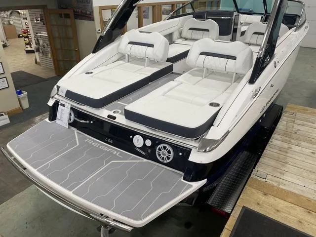 Slide: The Image of 2024 Regal LS6 boat interior with dual seating and modern design. - 9