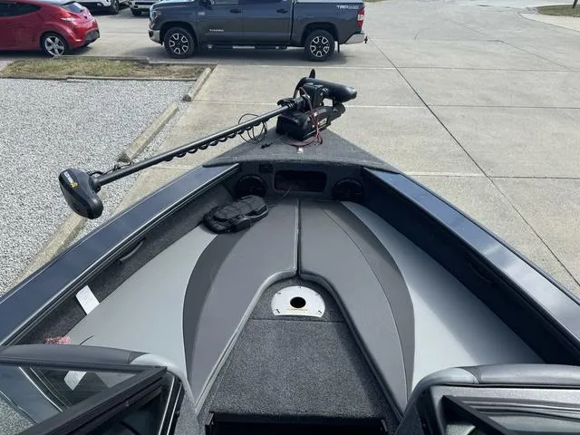 Slide: The Image of 2024 Lund 1875 Crossover XS Sport boat interior with trolling motor. - 11