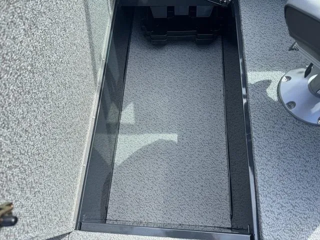 Slide: The Image of 2024 Lund 1875 Crossover XS Sport interior storage compartment. - 13