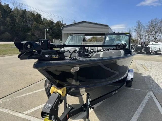 Slide: The Image of 2024 Lund 1875 Crossover XS Sport boat with Minn Kota trolling motor. - 5