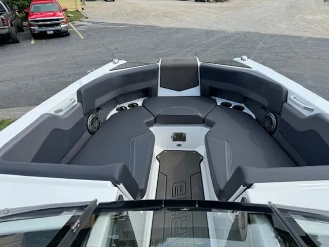 Slide: The Image of Interior of 2025 Scarab 235 Wake boat with gray seating and speakers. - 12