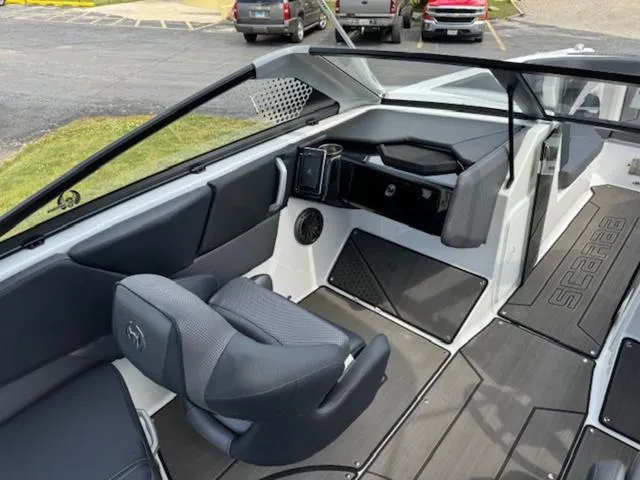 Slide: The Image of 2025 Scarab 235 Wake boat interior with modern seating and dashboard. - 13