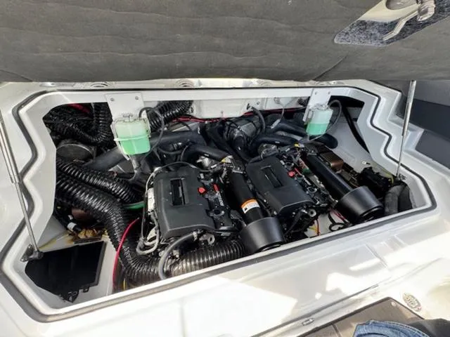 Slide: The Image of Engine compartment of a 2025 Scarab 235 Wake boat showing dual engines and components. - 18