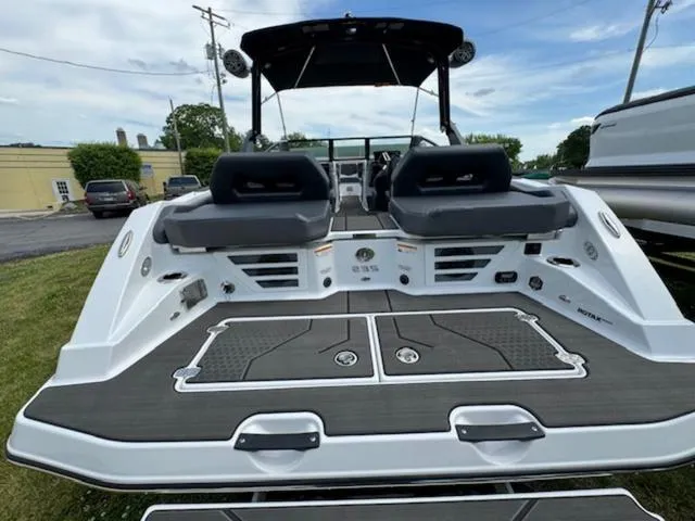 Slide: The Image of 2025 Scarab 235 Wake boat rear view with dual seating and swim platform. - 7