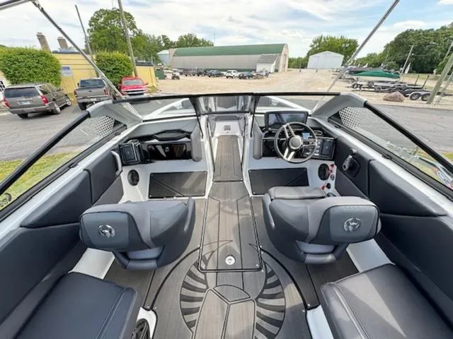 Slide: The Image of 2025 Scarab 235 Wake boat interior with modern dashboard and seating. - 9