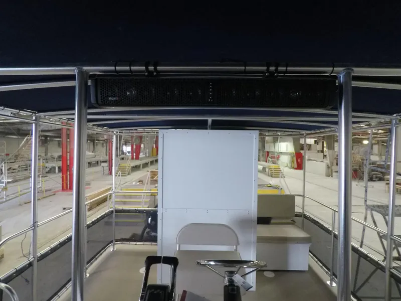 Slide: The Image of 2024 A&M Manufacturing BullDog 30 boat interior in a factory setting. - 11