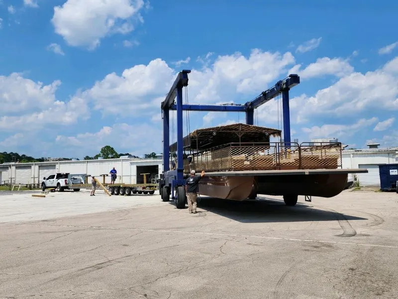 Slide: The Image of 2024 A&M Manufacturing BullDog 50 being transported at an industrial site. - 11