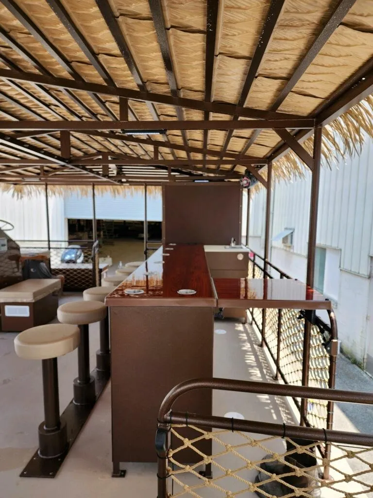 Slide: The Image of Outdoor bar area on A&M Manufacturing BullDog 50, 2024 model, with stools and canopy. - 15