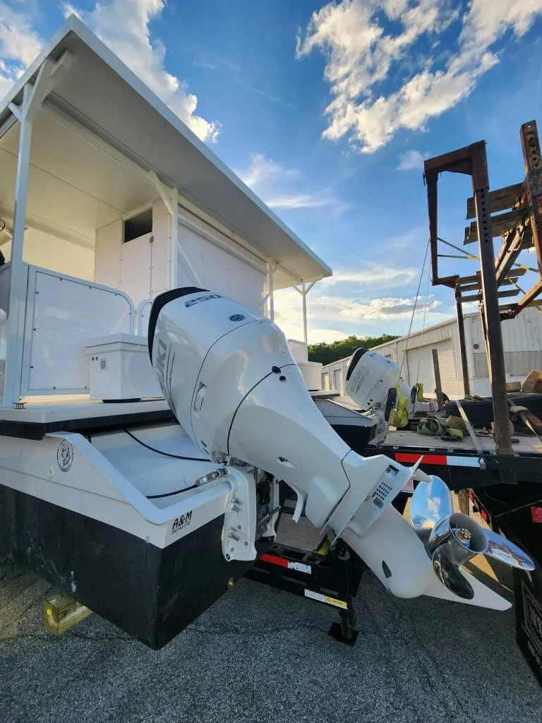 Slide: The Image of 2024 A&M Manufacturing BullDog 50 boat with outboard motor. - 19