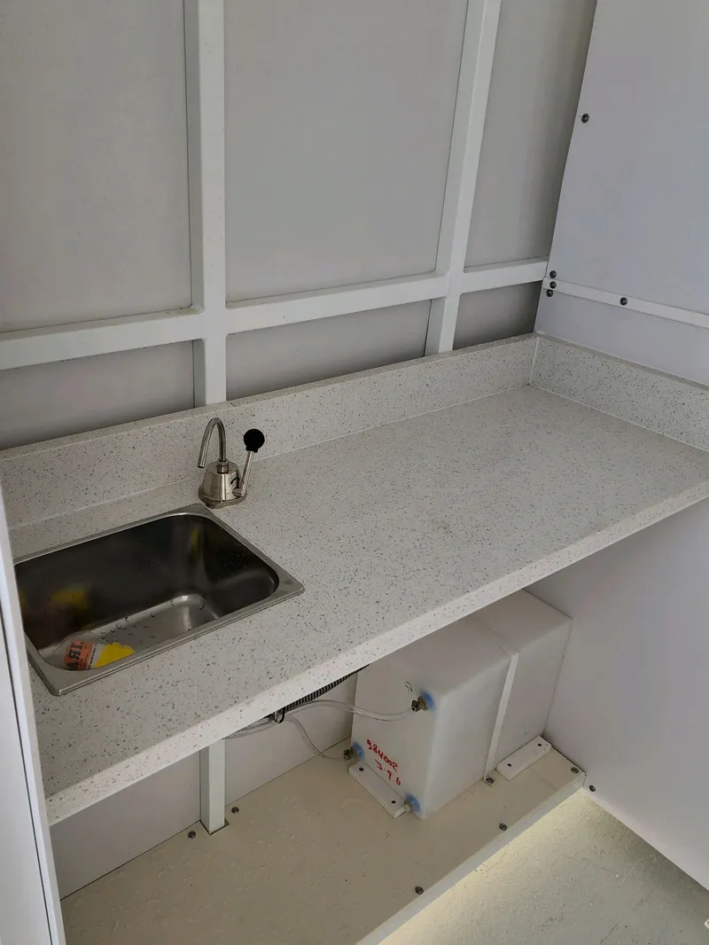 Slide: The Image of 2024 A&M Manufacturing BullDog 50 interior with sink and countertop. - 23