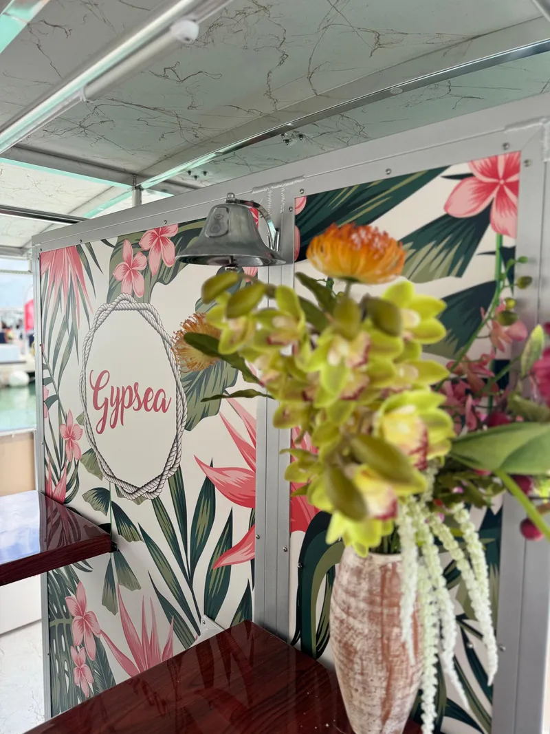 Slide: The Image of 2024 A&M Manufacturing BullDog 50 interior with floral decor and Gypsy sign. - 4