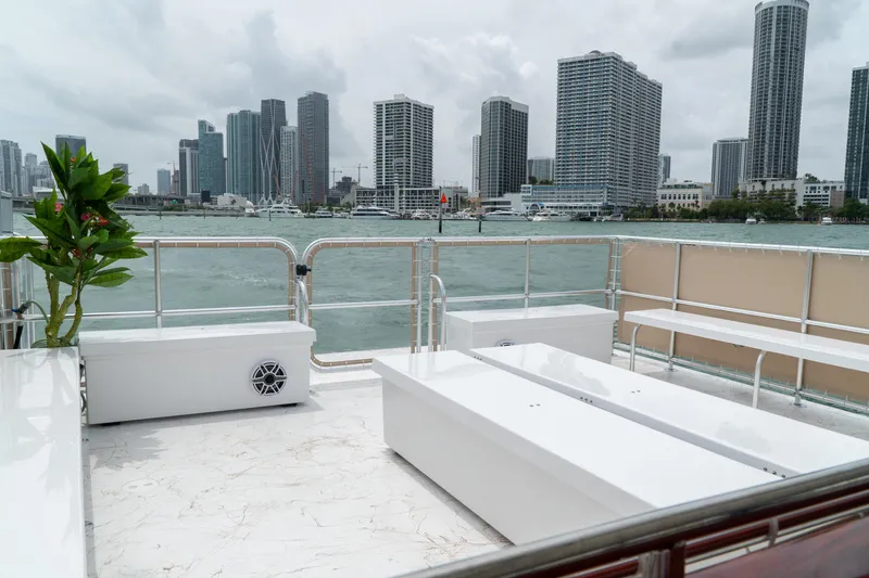 Slide: The Image of 2024 A&M Manufacturing BullDog 50 boat deck with city skyline view. - 5