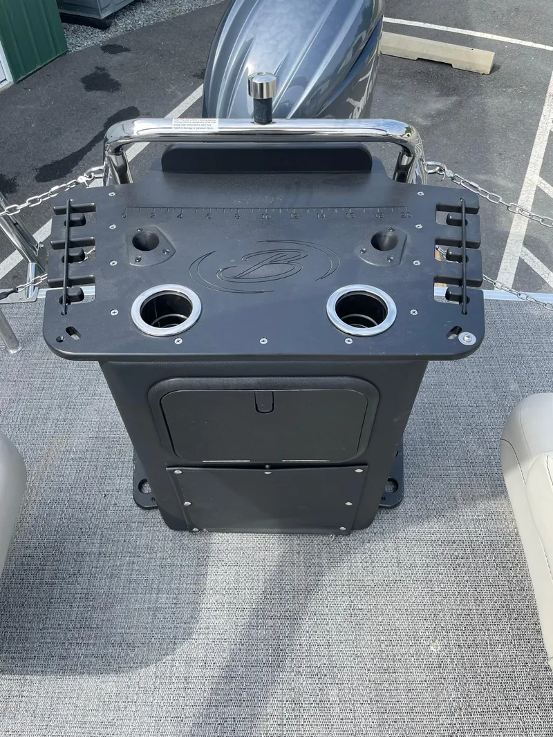 Slide: The Image of Barletta Aria 22CC 2024 boat console with cup holders and storage compartment. - 12